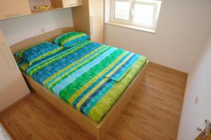 Postel nebo postele na pokoji v ubytování Apartments Leontina