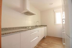 A kitchen or kitchenette at OLIVA HOLIDAYS 4