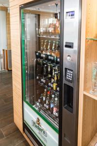 a vending machine filled with lots of bottles of beer at Fischer's Hotel Brauhaus in Mössingen