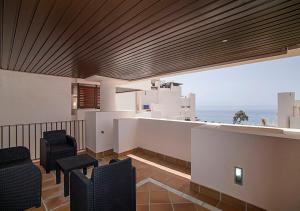 a living room with a view of the ocean at WaterFront Apartment in Estepona