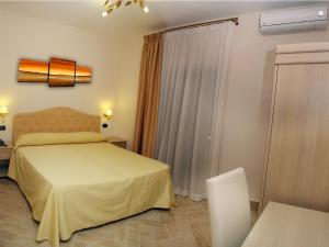 Postel nebo postele na pokoji v ubytování Hotel Barbato