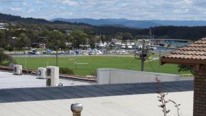 a large building with a lot of trees on top of it at Beachview Motel - Adults Only in Bermagui