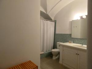 a bathroom with a toilet and a sink at Pantelia Pyrgos in Pyrgos