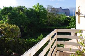 a wooden stairway leading to a garden with trees at Hotel Fala Zagreb in Zagreb