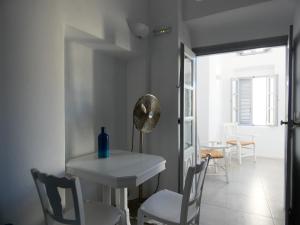 a room with a table and chairs and a mirror at Pantelia Pyrgos in Pyrgos +20 photos