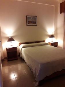Una cama o camas en una habitación de Hotel Molise