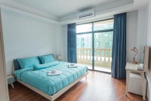 Tempat tidur dalam kamar di 钻石名邸 Diamond One Hotel and Serviced Apartment