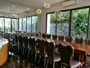 a conference room with a long table and chairs at Nancy Vung Tau Villa in Vung Tau +154 photos