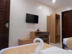 Postel nebo postele na pokoji v ubytování Rublin Hotel Cebu