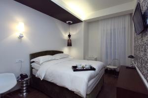 Postel nebo postele na pokoji v ubytování Hotel Metropolis + 37 fotografií