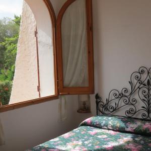 Ένα ή περισσότερα κρεβάτια σε δωμάτιο στο Villa Prua