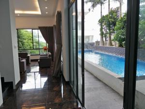 a view of a swimming pool from a hotel lobby at Nancy Villa in Vung Tau