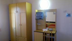 a room with a room with a room with a tv at Hotel Centrale in Argenta