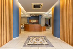 a lobby with a reception desk in a building at Hotel Elena in Nafplio
