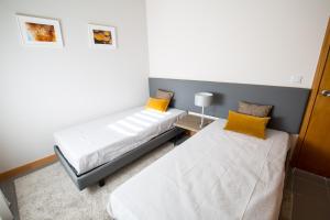 Ένα ή περισσότερα κρεβάτια σε δωμάτιο στο Desafios da Horta