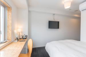 TV a/nebo společenská místnost v ubytování Nikko Station Hotel 2