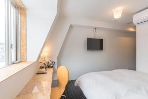 TV a/nebo společenská místnost v ubytování Nikko Station Hotel 2