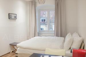 Katil atau katil-katil dalam bilik di Albergo Diffuso Porrentruy