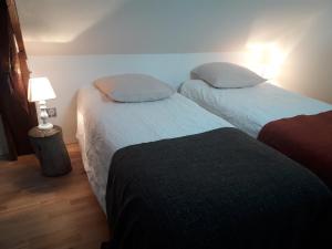 Кровать или кровати в номере Ecluse de la Tindière