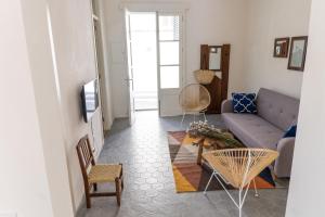 a living room with a couch and a table at Blue Casita ETV 7845 in Pollença
