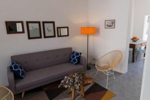 a living room with a couch and a table at Blue Casita ETV 7845 in Pollença +18 photos