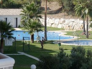 a man playing a game of volley ball in a pool at Penthouse with Private Roof terrace and jacuzzi in Fuengirola