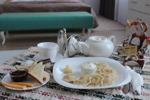 a plate of food on a table at Hotel Sluch in Starokostyantyniv