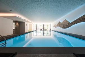 Bazén v ubytování Hotel Pfeiss nebo v jeho okolí