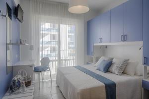 Postel nebo postele na pokoji v ubytování Hotel Solemare - Frontemare - 3 Stelle Superior
