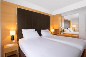 Postel nebo postele na pokoji v ubytování Relais Spa Chessy Val d'Europe