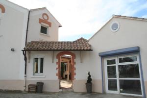a white house with a door and a window at Villa Les Terrasses Tamaris Les Sablettes in La Seyne-sur-Mer +66 photos