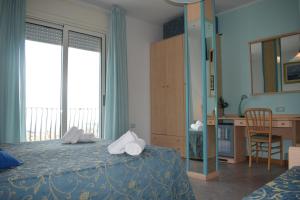 Postel nebo postele na pokoji v ubytování Hotel Solemare - Frontemare - 3 Stelle Superior