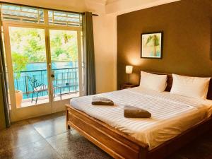 Кровать или кровати в номере Prantara Heritage Suites