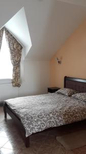 Postel nebo postele na pokoji v ubytování Hotel