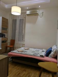 a bedroom with a bed in a room at Imperia Apartments in Belgrade