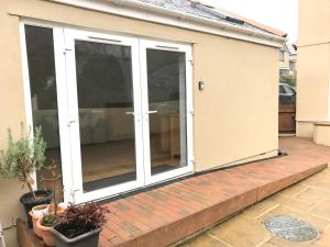 an extension to a house with sliding glass doors at The Annex - Penzance town centre with parking in Penzance