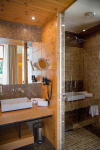 a bathroom with a sink and a shower at Weingut Taggenbrunn in Sankt Veit an der Glan