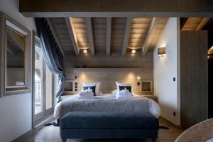 Ένα ή περισσότερα κρεβάτια σε δωμάτιο στο Le C by Alpine Residences