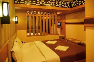 Postel nebo postele na pokoji v ubytování Grand Choice