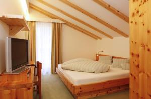 Postel nebo postele na pokoji v ubytování Hotel Stefaner