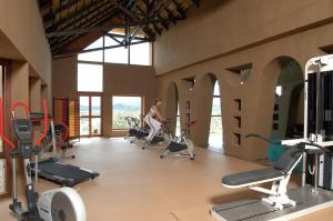 a woman is working out in a gym at Gocheganas Lodge in Gocheganas
