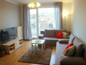 Televízia a/alebo spoločenská miestnosť v ubytovaní livingROOM_Wroc_Mosiężna