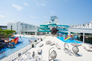 a water park with a slide and a pool at Apartamenty przy Latarni in Niechorze