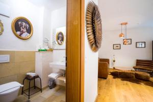 a bathroom with a toilet and a sink at Hotel Rote19 in Regensburg