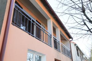 a building with windows on the side of it at House Pravilovic apartments in Cetinje