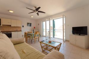 TV i/ili zabavni centar u objektu Sali Modern Seaview Apartment