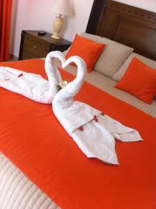 Ένα ή περισσότερα κρεβάτια σε δωμάτιο στο Figaro Hotel Samana