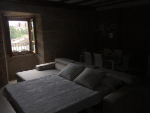 Posteľ alebo postele v izbe v ubytovaní Apartamento Ribera Del Puente