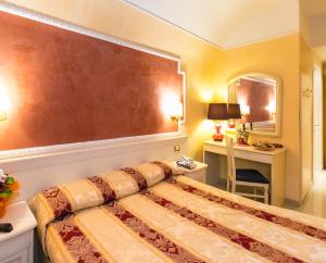 Postel nebo postele na pokoji v ubytování Hotel Erdarelli