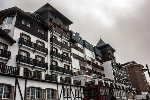 a large white building with balconies on the side of it at IMEDA apartamento ATLAS Sierra Nevada in Sierra Nevada